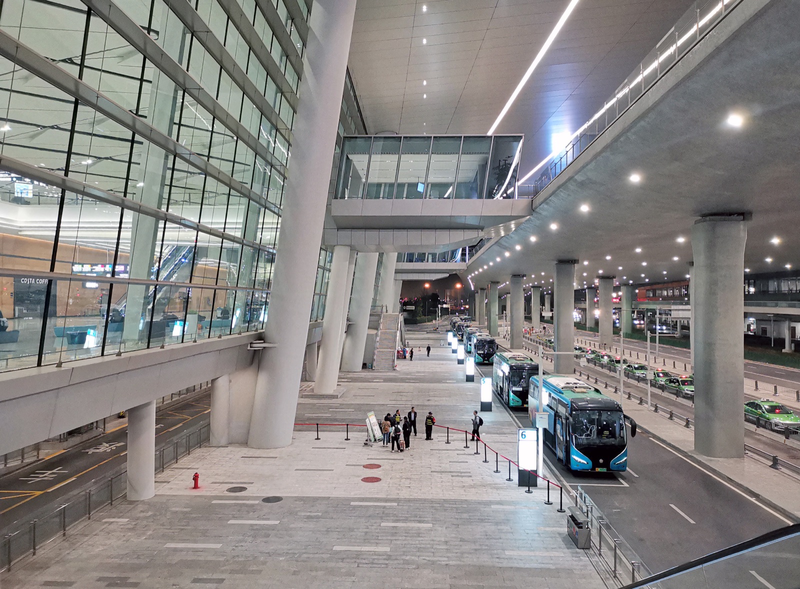 The Tianfu Airport bus boarding area (2025), with numbered waiting bays and the taxi queue alongside.